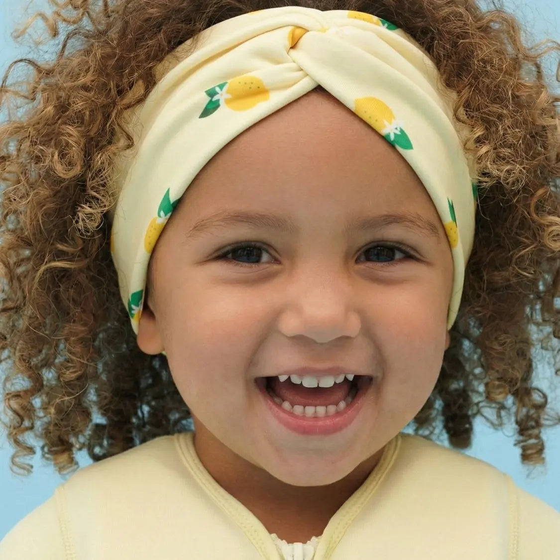Cinta para la cabeza anti-UV para niña Plouf